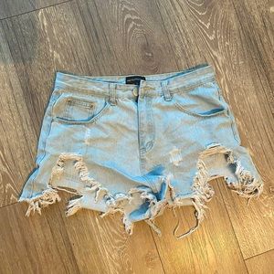 Light wash denim distressed shorts